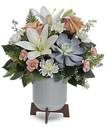 Sleek meets sweet! This arrangement pairs a sculptural succulent with soft blooms