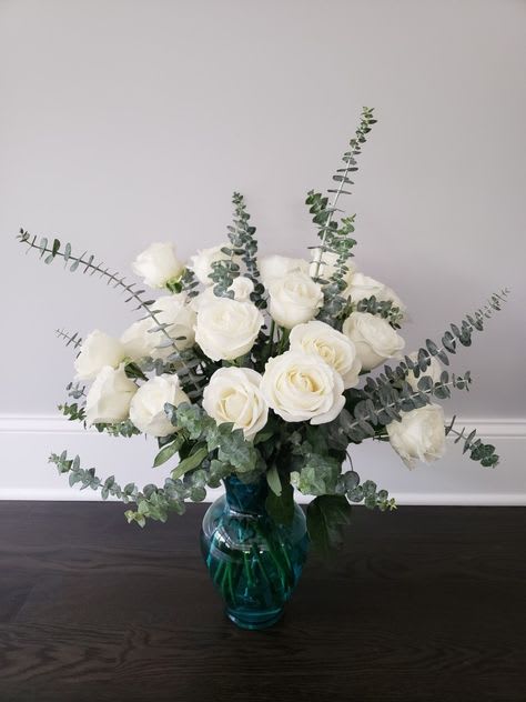 All white roses and eucalyptus