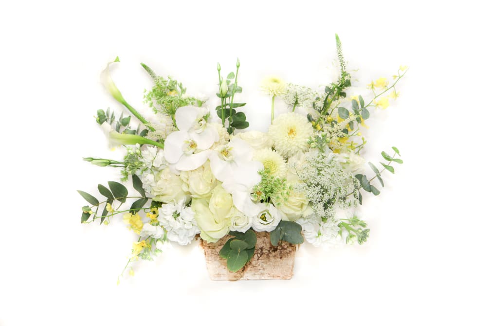 This stunning white arrangement is both chic and understated. White garden roses