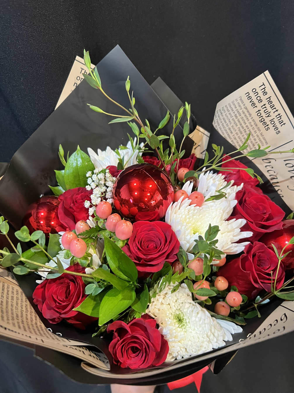 Beautiful and vibrant bouquet with holidays vibes with roses,carnations,ornaments and more 