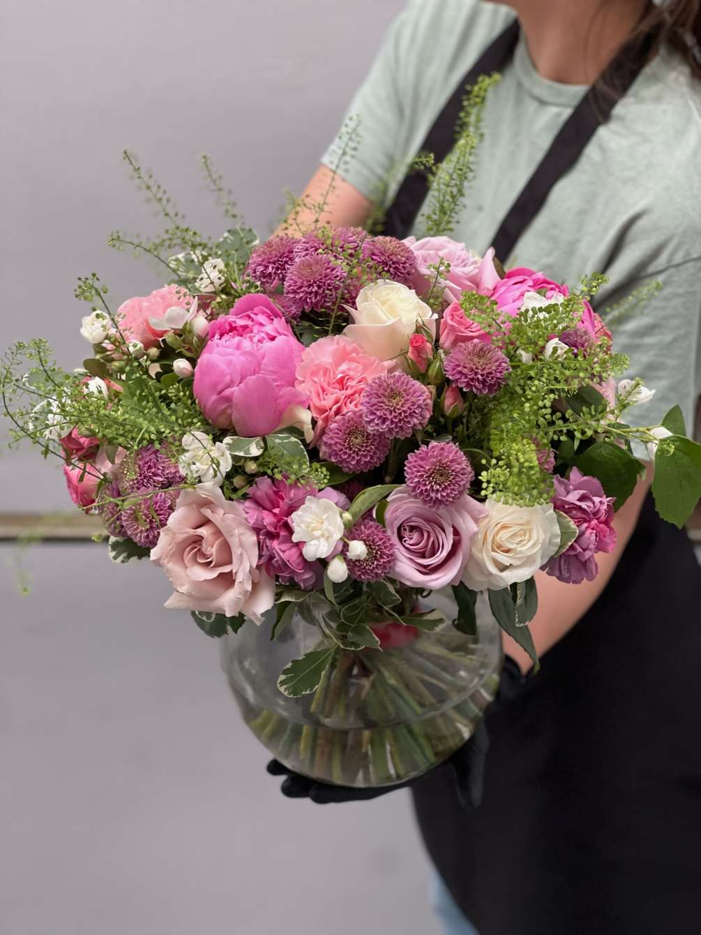 Arrangement in a vase of roses, chrysanthemum, carnations, peony, waxflower, greenery. Perfect
