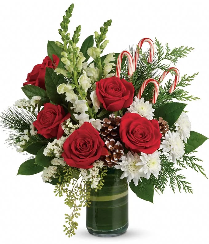 Send holiday greetings with this bouquet of red roses, white snapdragons, and