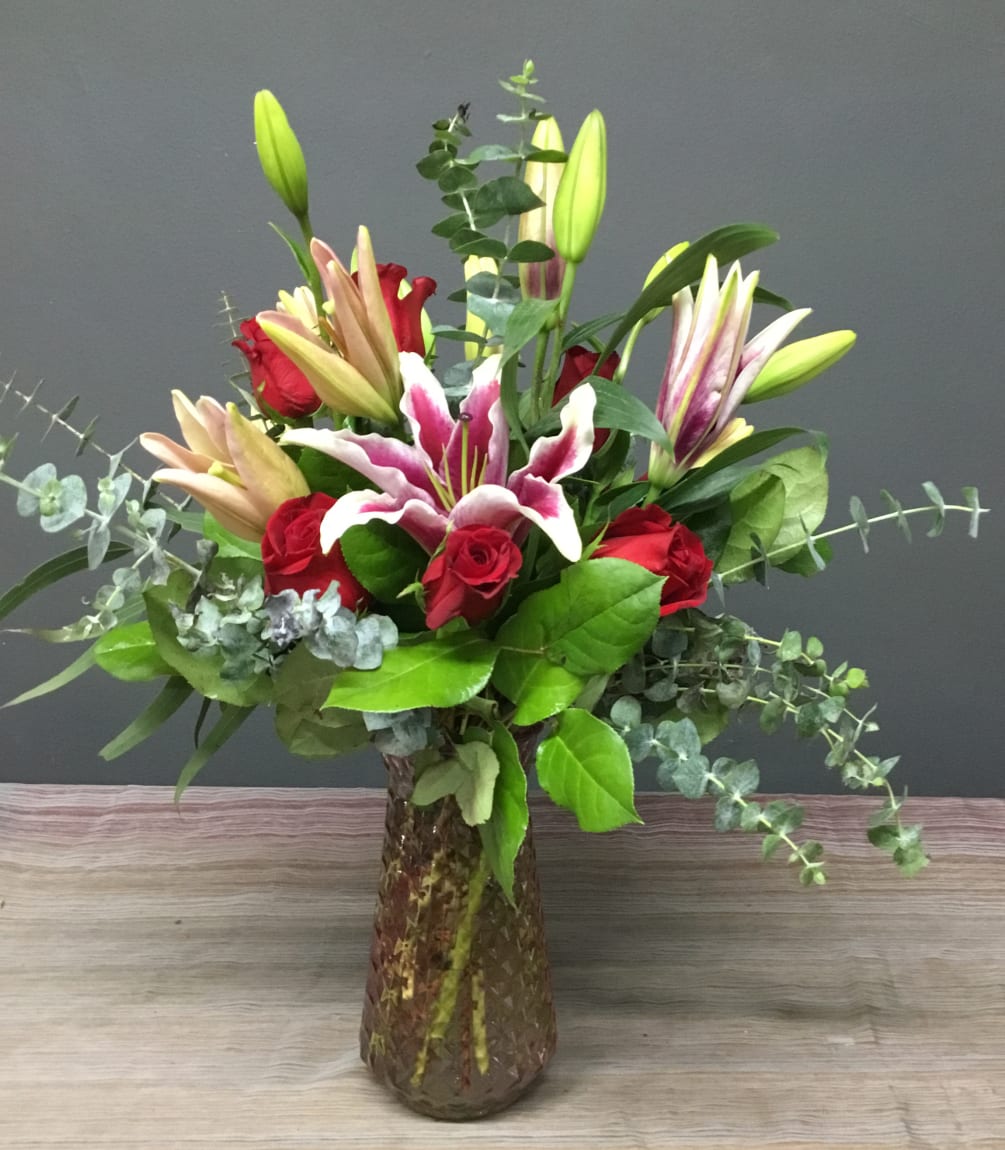 Roses, Eucalyptus and Stargazer Lilies in a Clear Vase.