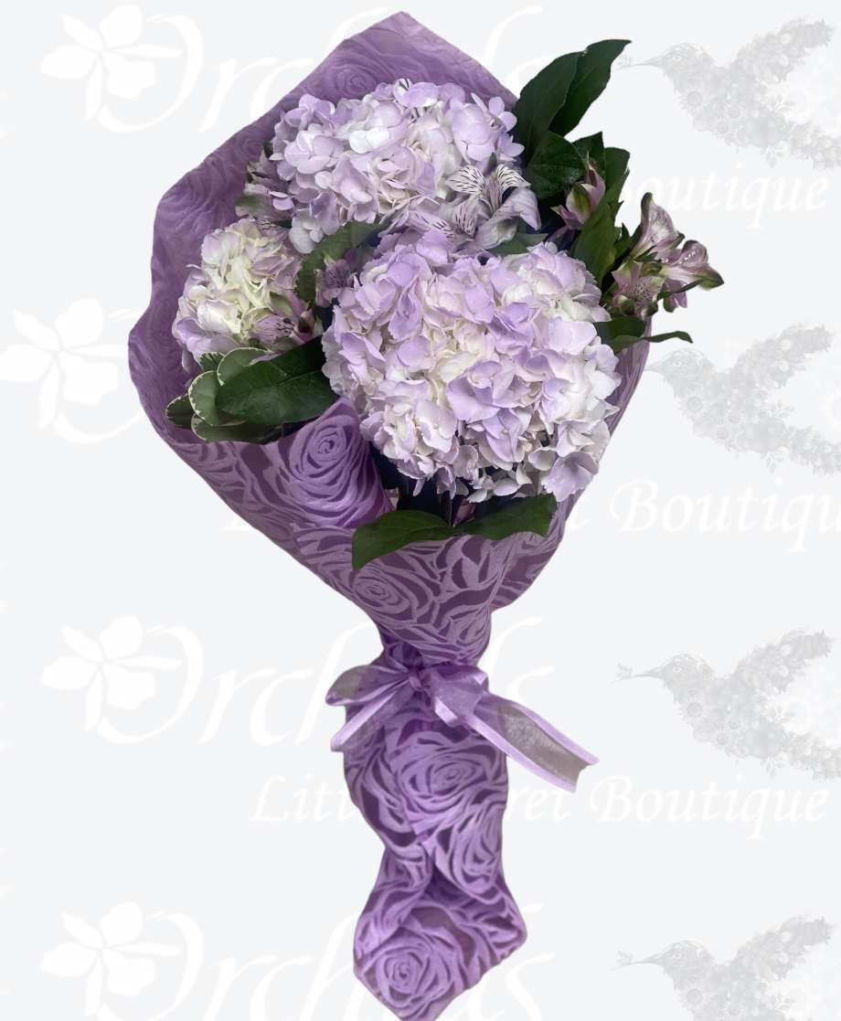 Surprise her with a beautiful bunch of lavender white hydrangea wrapped bouquet
