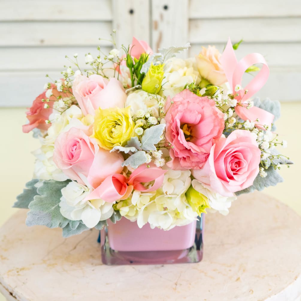 Usher in love with this elegant arrangement perfect for the celebration of
