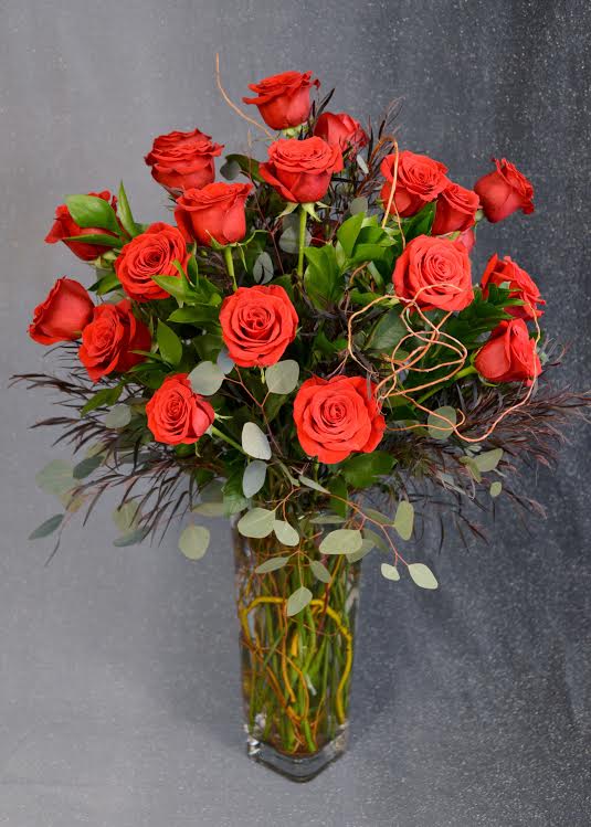 24 gorgeous, long stemmed, luscious red roses hand arranged in a square