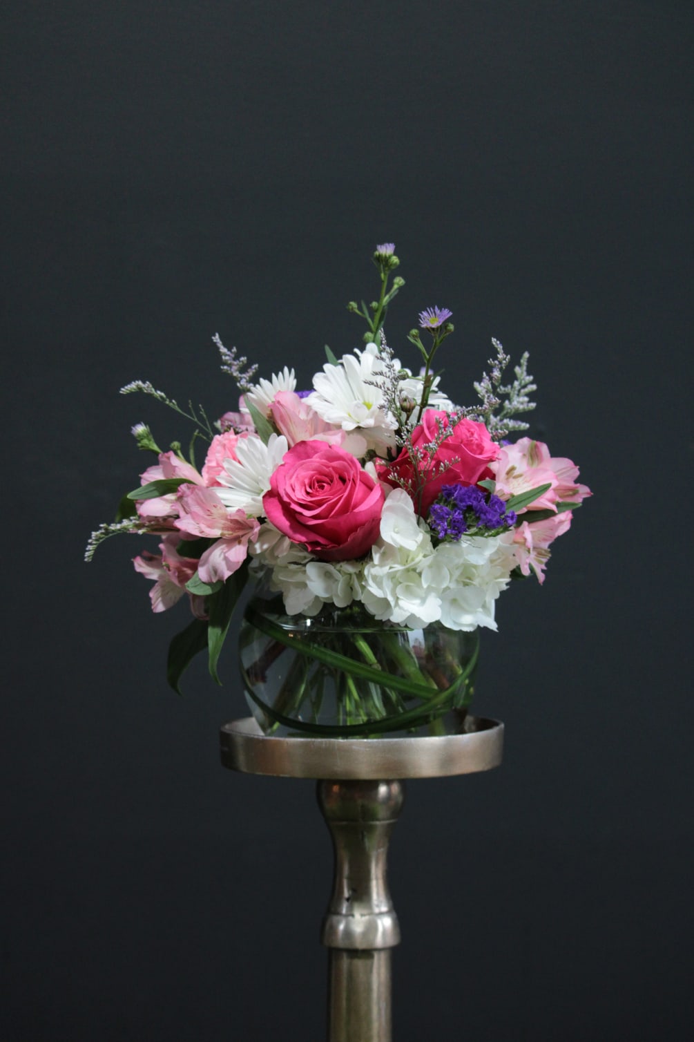 An airy free flowing arrangement full of spring color and life! 