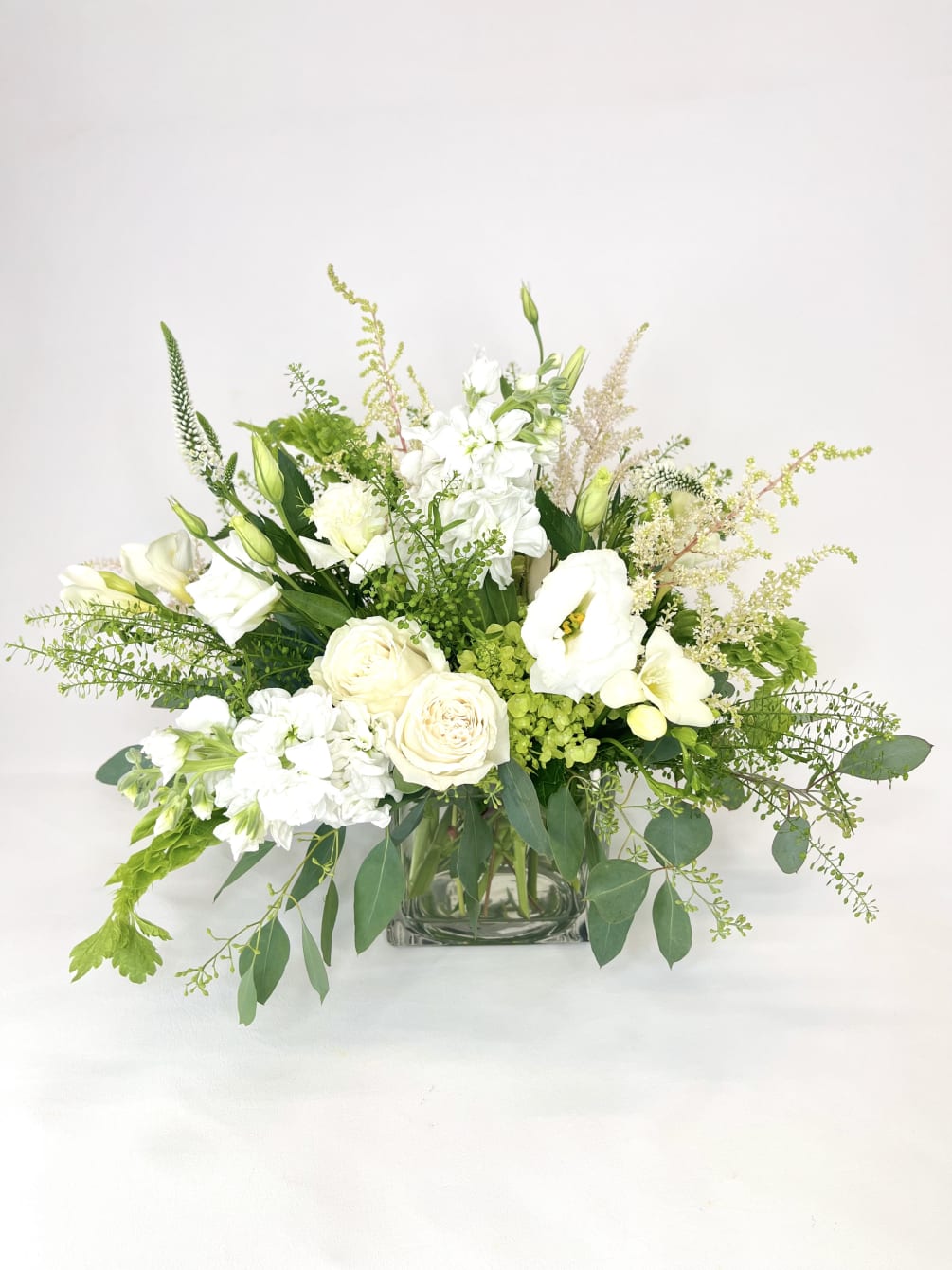 A lovely 5x5 cube with white &amp; mini green hydrangea, dianthus, viburnum