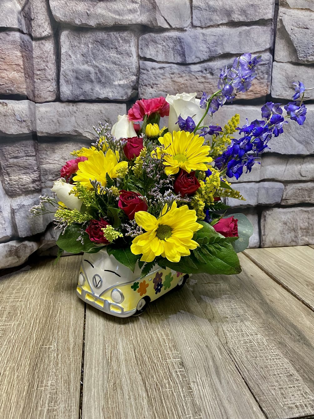 This bright, cheerful, hearty arrangement will bring out the hippy in everyone.