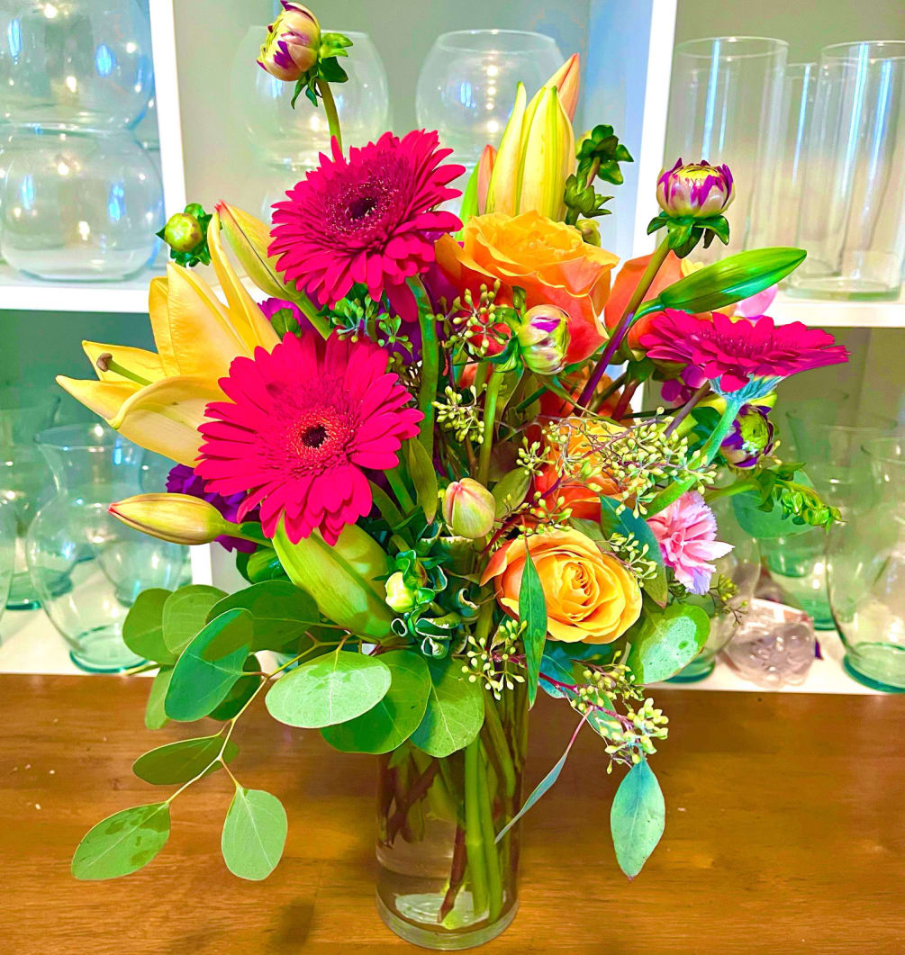 A fun and funky arrangement  filled with colorful and vibrant seasonal