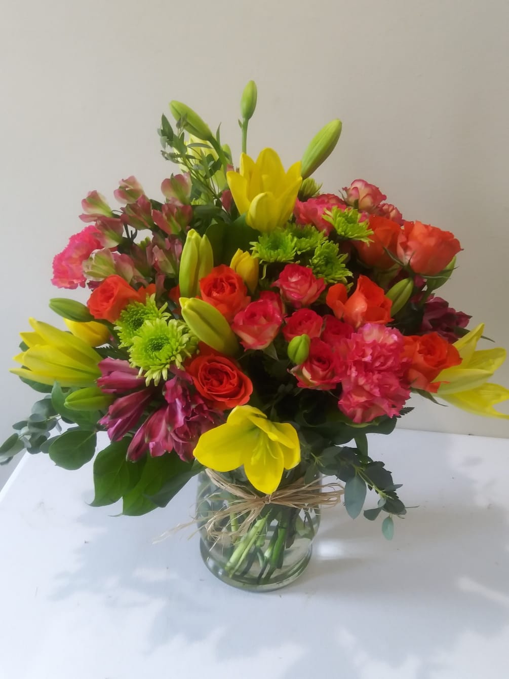 lilies ,spray roses ,tulips ,green buttons ,purple altros