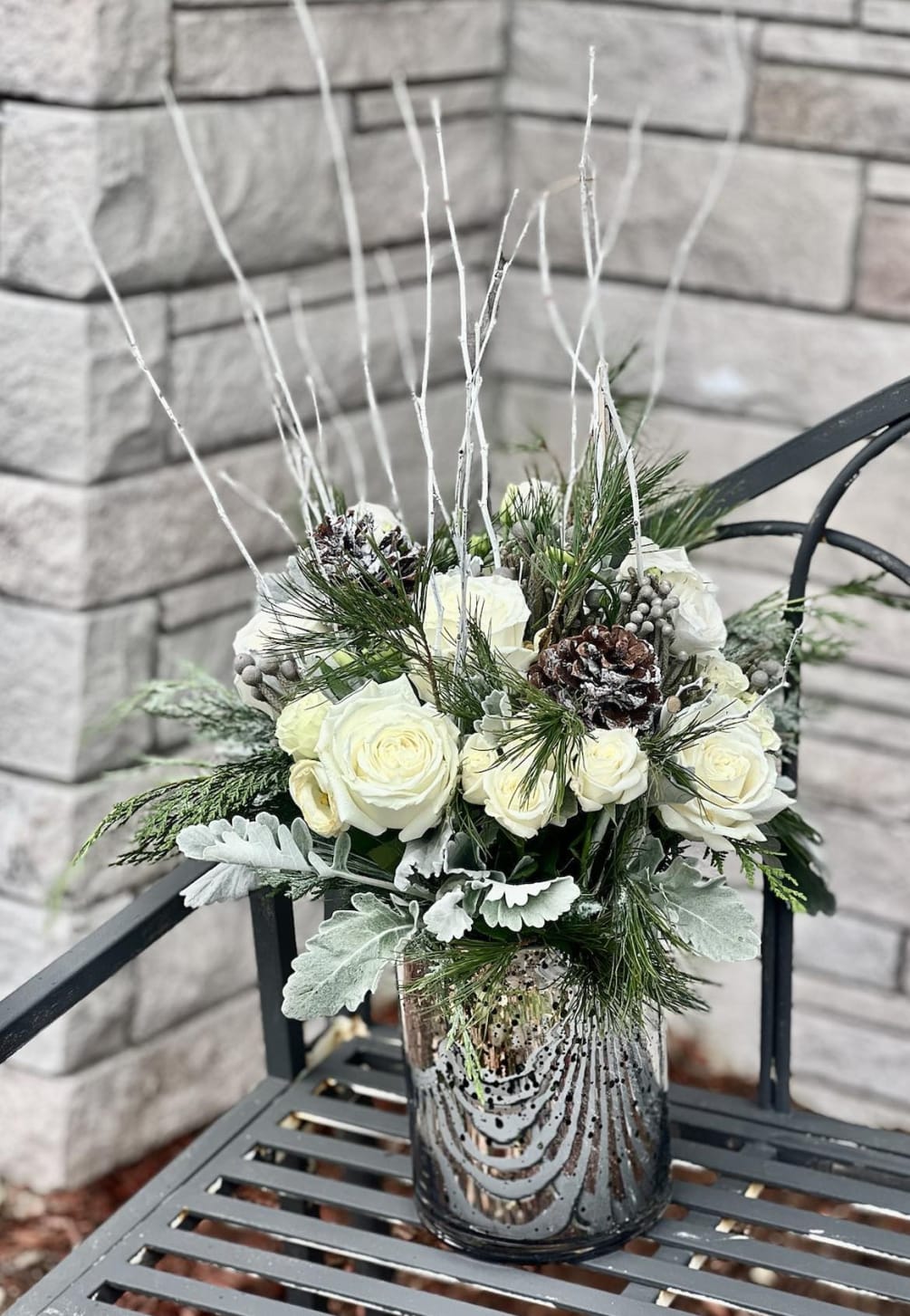Dazzle them with a winter wonderland of blooms. Our beautiful arrangement captures