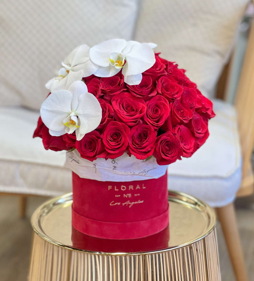 Luxury arrangement designed with Red Roses and Orchids in our signature box.

Available