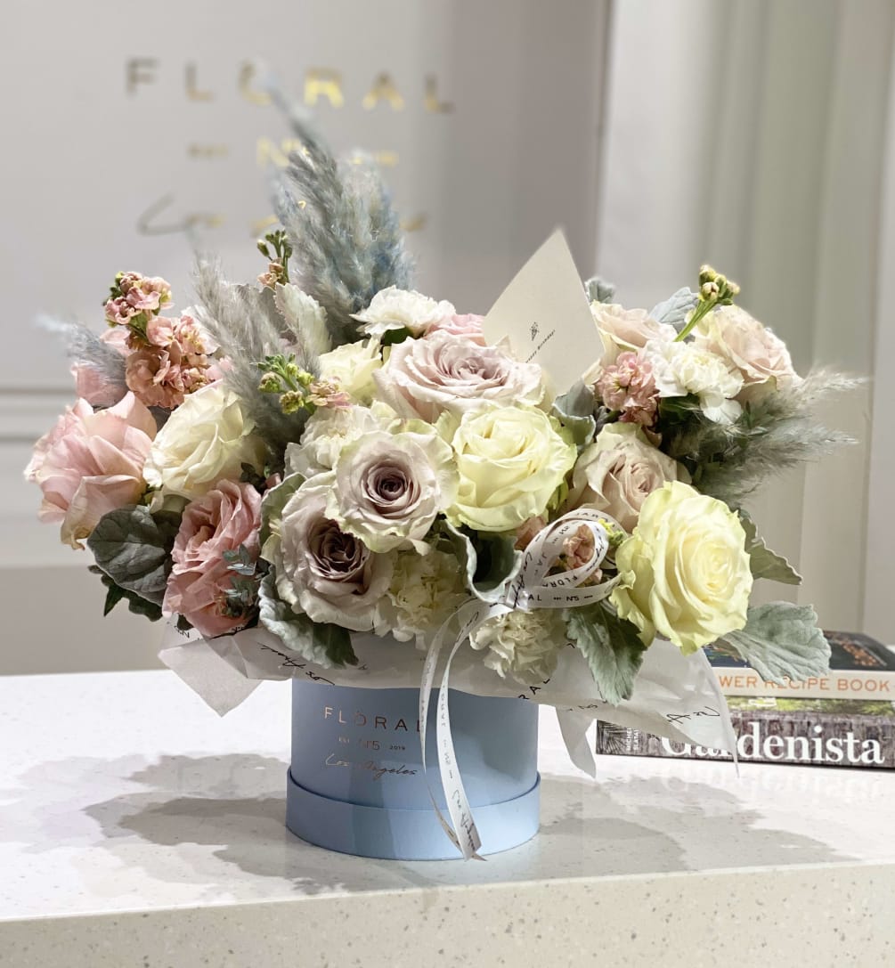 A rich and diverse composition with Roses, Hydrangeas and Carnations. 

Available in