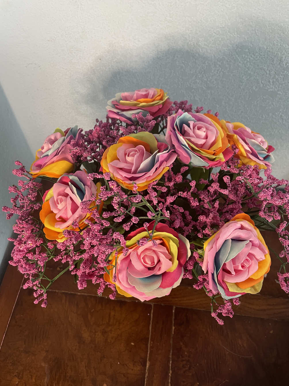 Gorgeous multicolor Roses with beautiful pink baby&rsquo;s breath on a amethyst purple