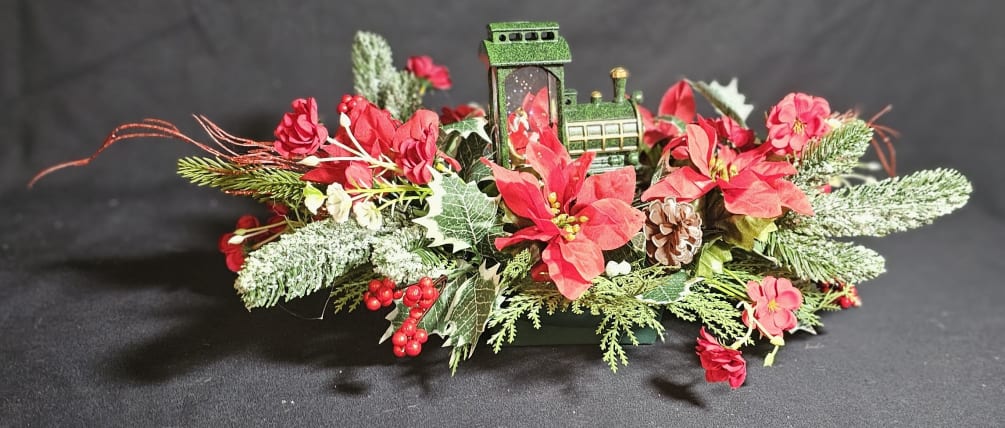 Lightup Santa train candle in classic poinsettia piece
