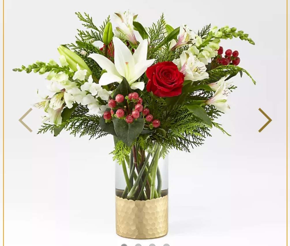 A modern take on a holiday classic, this fresh Christmas bouquet comes