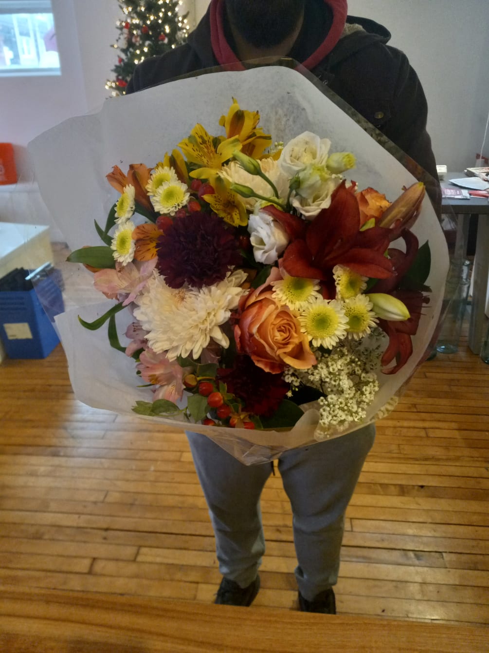 Beautiful fresh mix of varied flowers wrapped up as a simple bouquet