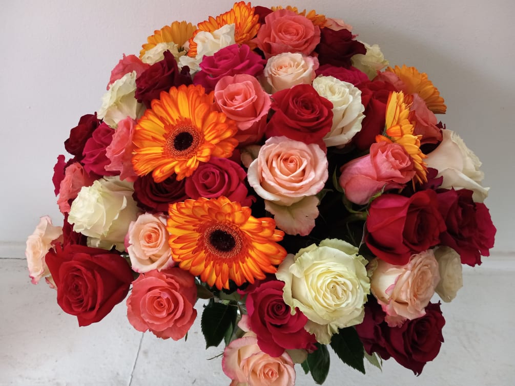 Absolutely stunning mix of 9 different colors of roses and &quot;Spotlight&quot; gerbera