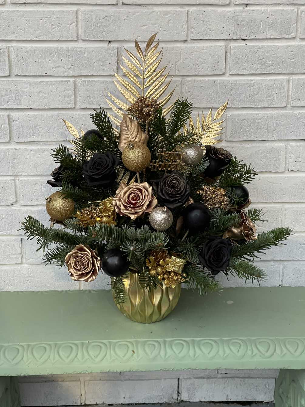 This beautiful tree is designed with beautiful black and gold roses, christmas