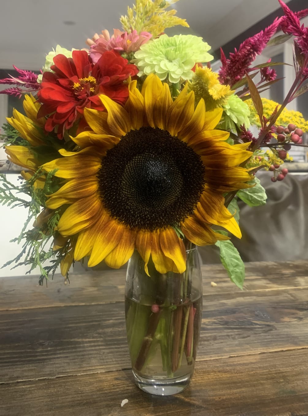 A lovely mixed bouquet with sunflowers and zinnias
