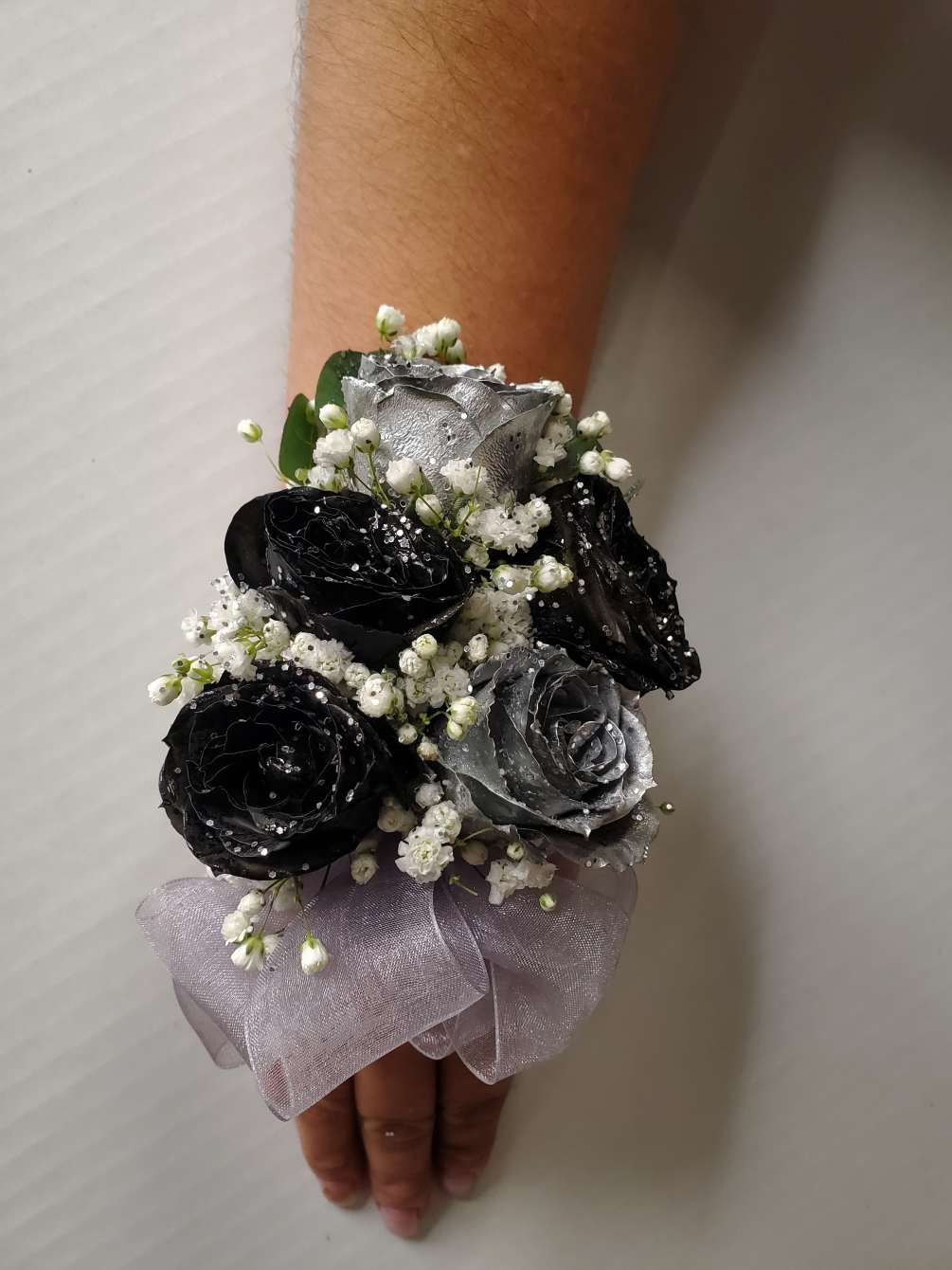 Corsages silver and black by Flowers by Manny