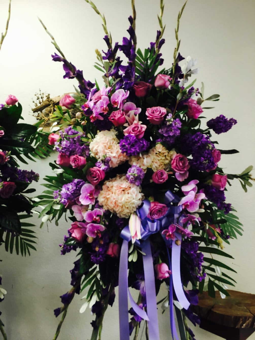 This beautiful standing spray consists of lavender roses, lavender stock, purple stock