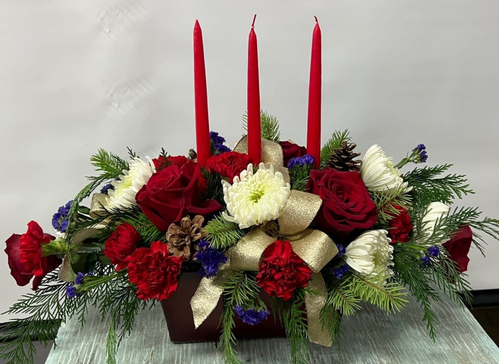 Centerpiece arrangement designed in a dark brown wooden box container. Embellished with