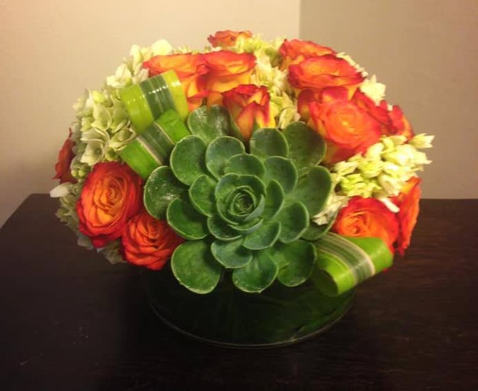 Roses, Hydrangeas, and Succulents in a glass vase