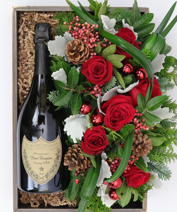 The elegant combination of Champagne and flowers makes a classic seasonal gift.