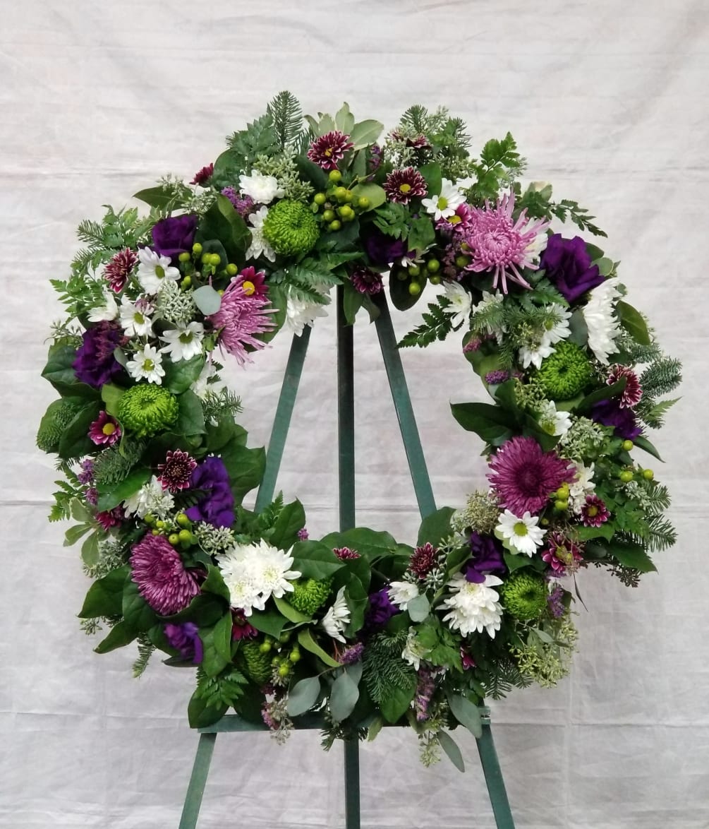 Select this 22&quot; wreath that includes lisianthus, hypericum and more in purple