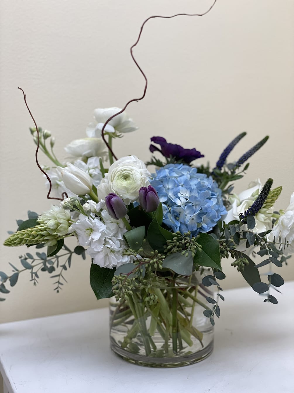 This arrangement is very pleasing to the eye, we use seasonal flowers