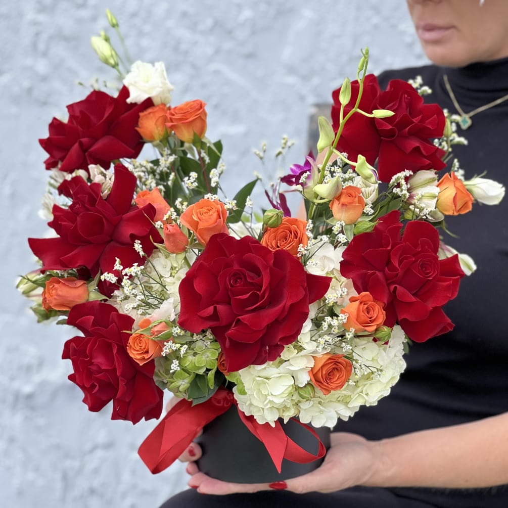 The Scarlet Reflections Box is a chic and striking floral arrangement that