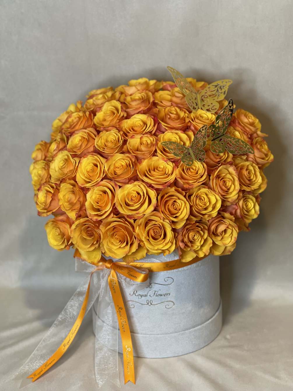 50 high quality roses in a box with golden butterflies are ready