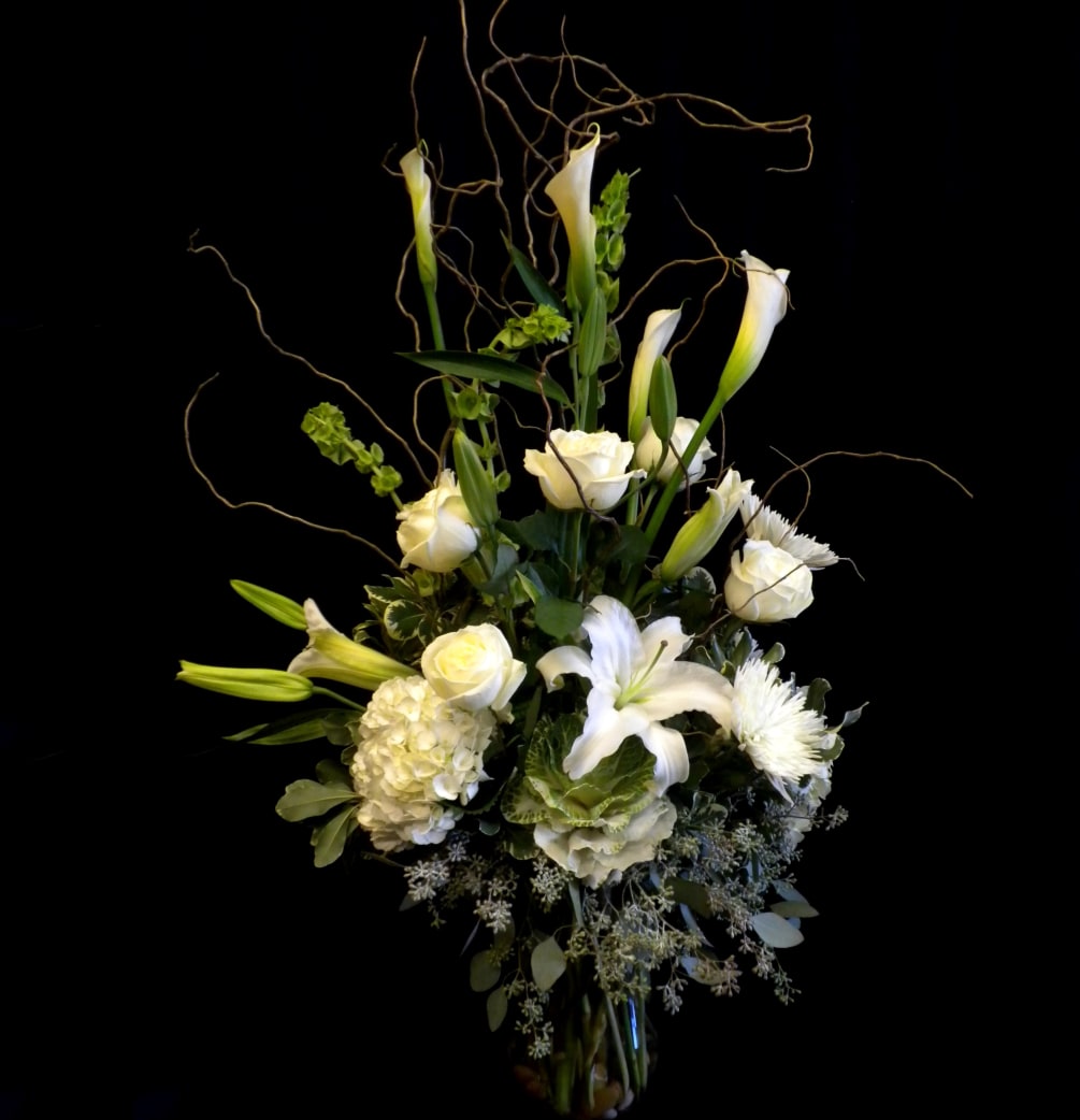 A beautiful Large vase arrangement of all white flowers such as:
Hydrangeas, Kale
