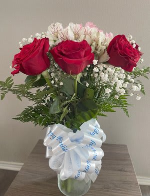 Beautiful bouquet of twelve long stem red roses, white alstroemeria flowers, baby&rsquo;s