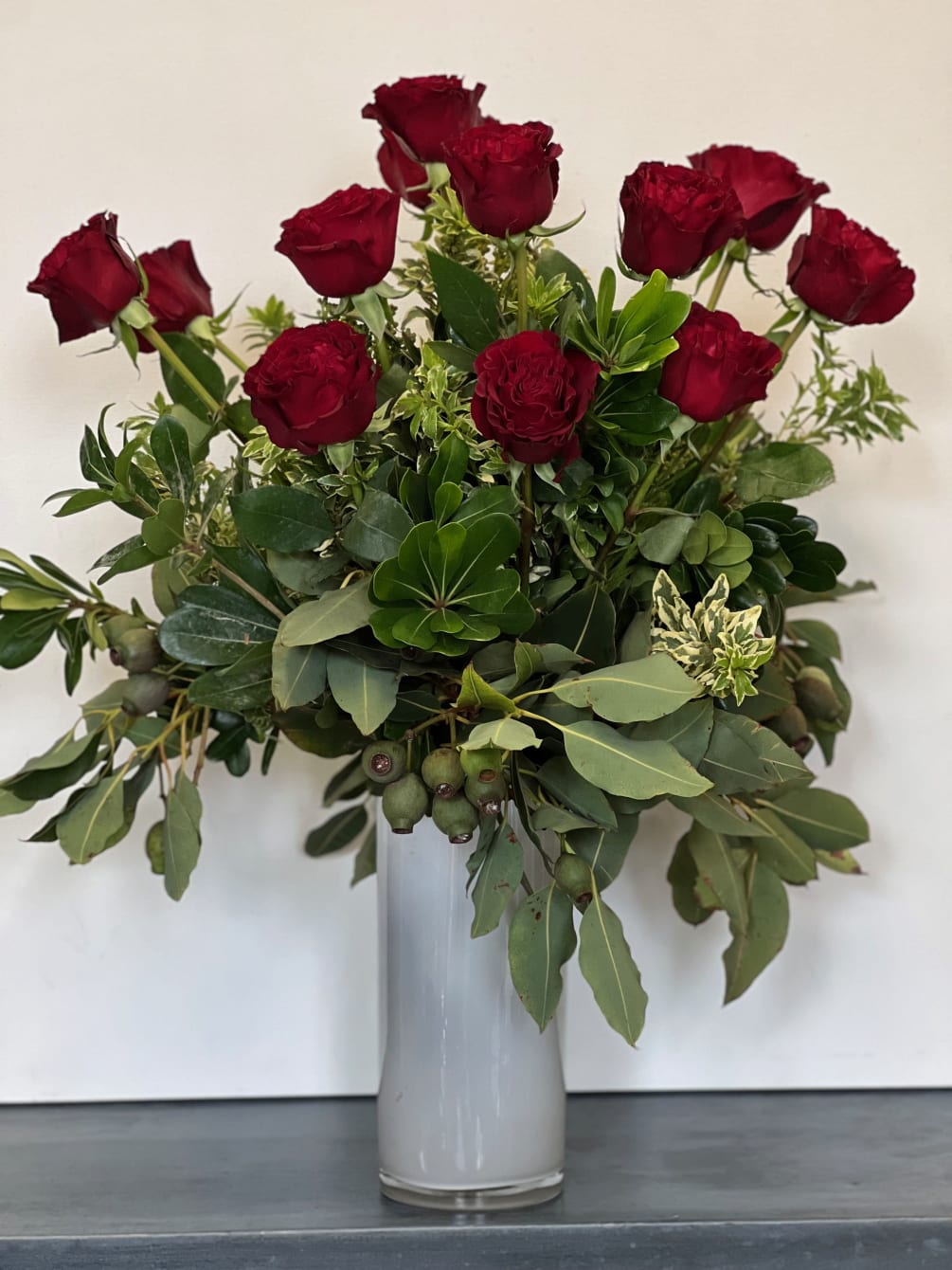 The traditional go-to arrangements, our dozen red roses come accented with lush