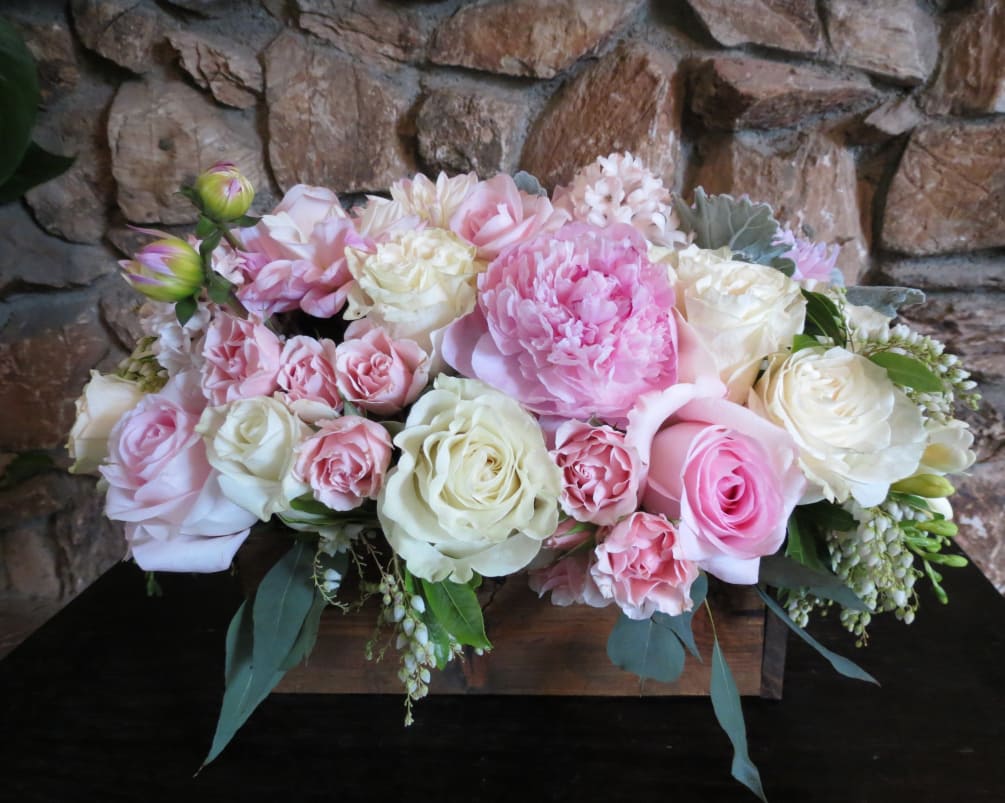Roses, dahlias, and peonies arranged on a wood box (vase size 10x5)
