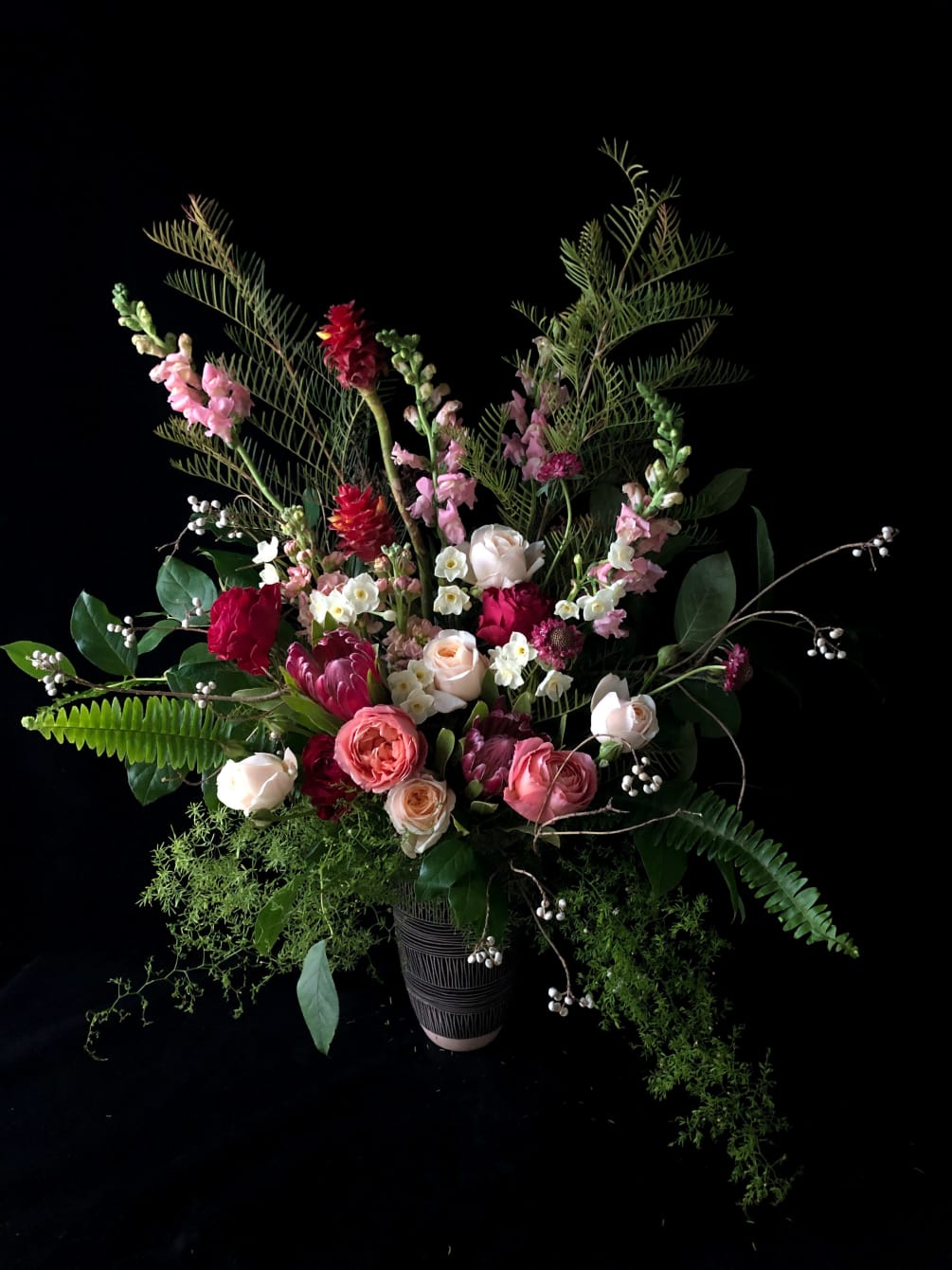 A large, breathtaking arrangement full of fragrant Garden Roses, Protea, Scented Stock