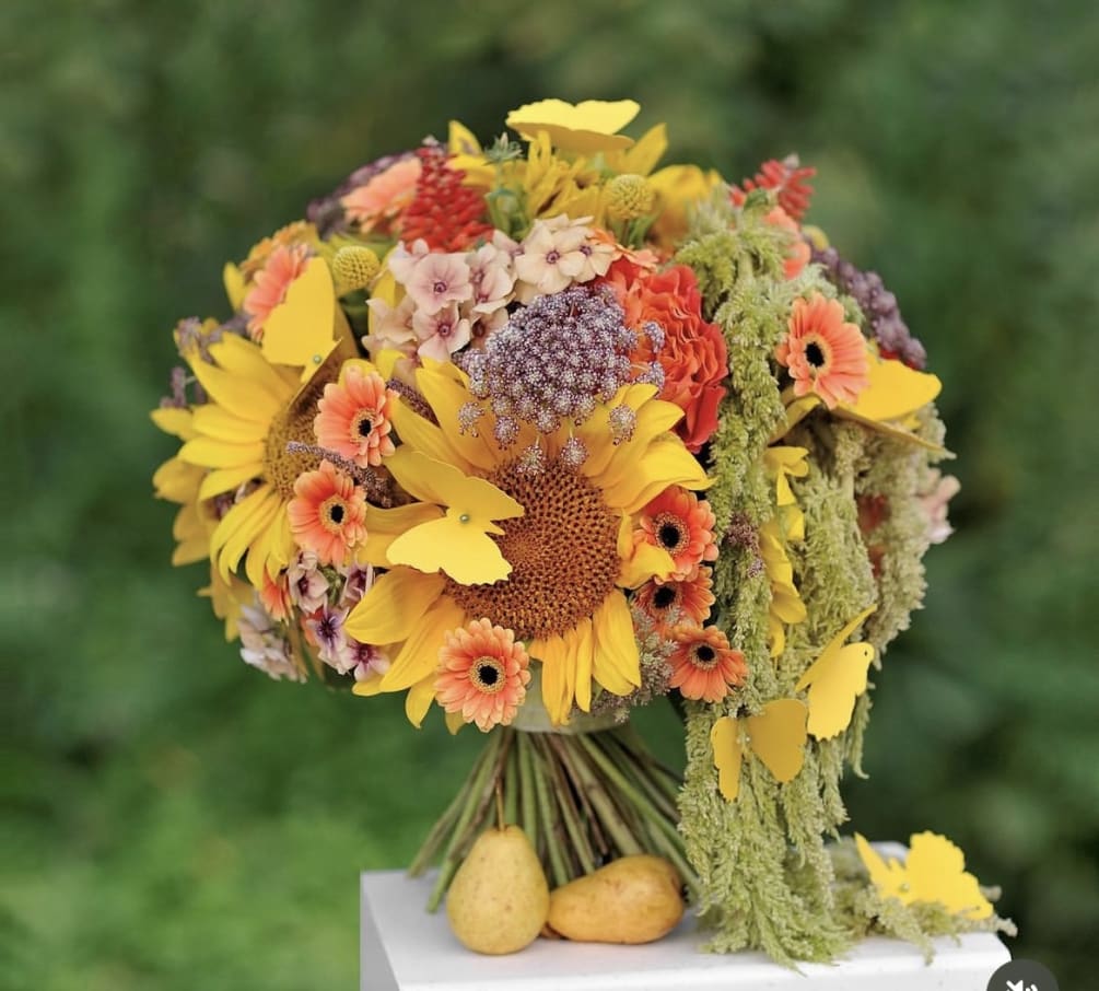 Sunflowers exude a warmth that radiates from their vivid yellow petals, symbolizing