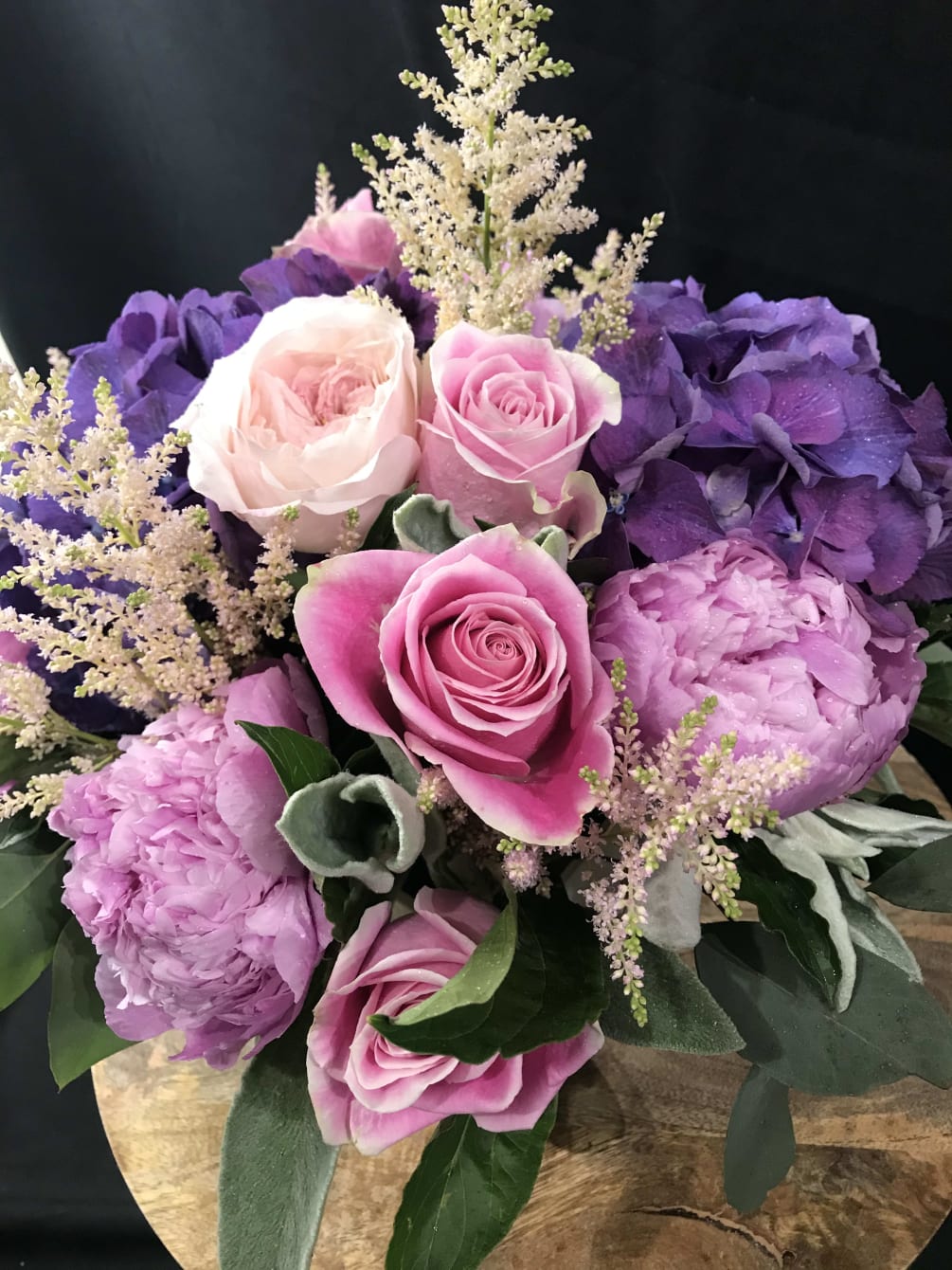This arrangement takes the classic color combination of pink and purple and