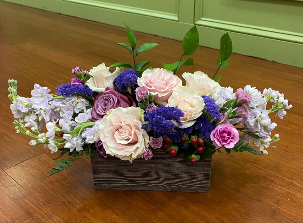 Light pink roses, purple roses, lavender and white stock, purple statice, 
