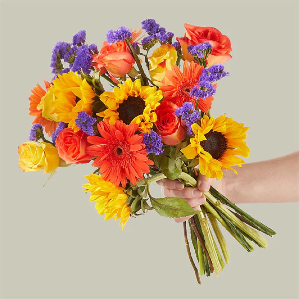 Cheer up someone&#039;s day with sunflowers and warm roses with our Blossoms