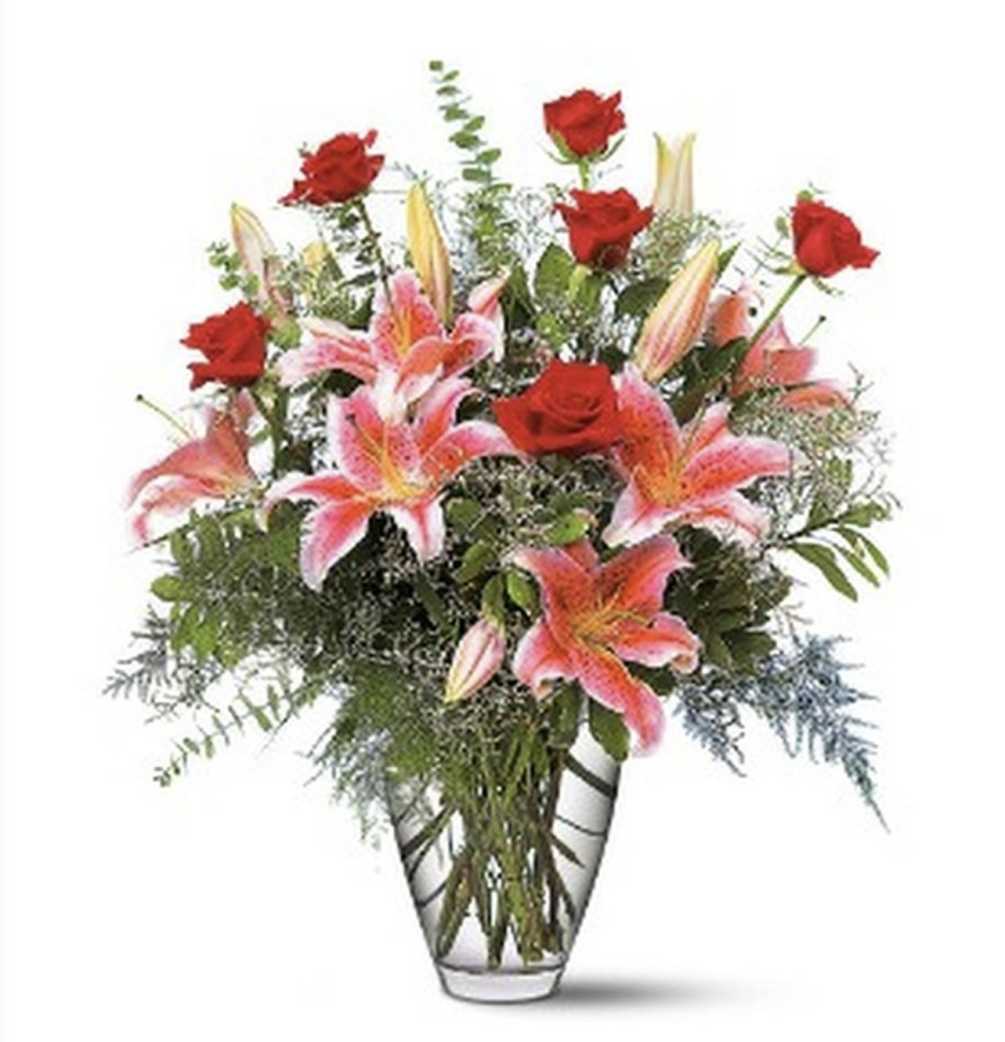 This romantic arrangement of lilies and roses will help to celebrate any