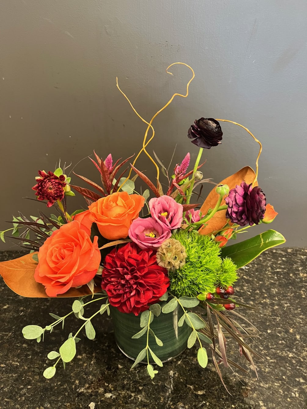a modern twist with Kansas flowers including lisianthus, ranunculus, roses, green tricks