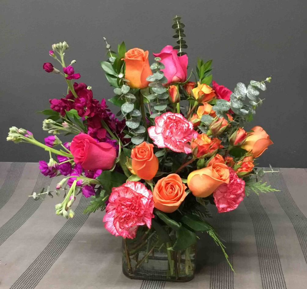 Hot Pink, Orange, and Purple Stock, Roses, Carnations and Eucalyptus in Cube