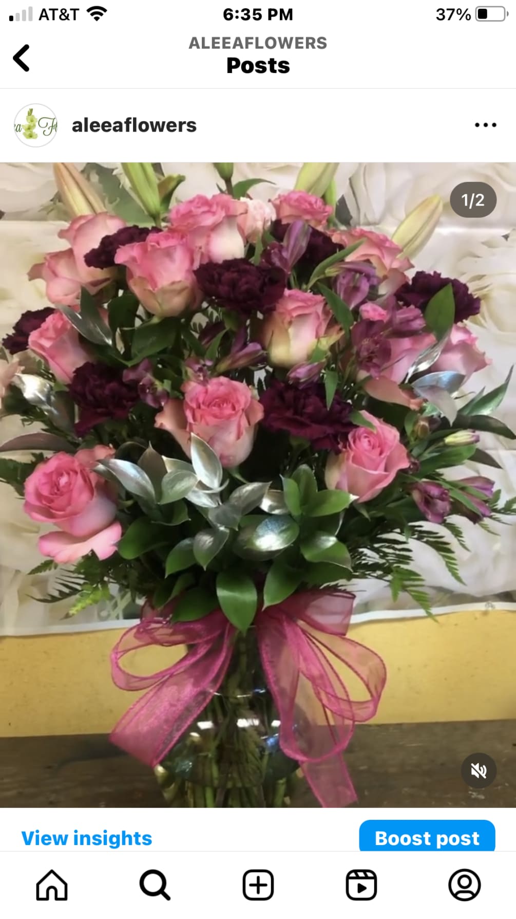 12 PINK ROSES, 6 PURPLE CARNATIONS, PURPLE ALSTROMERIA AND SILVER RUSCUS FILLER.