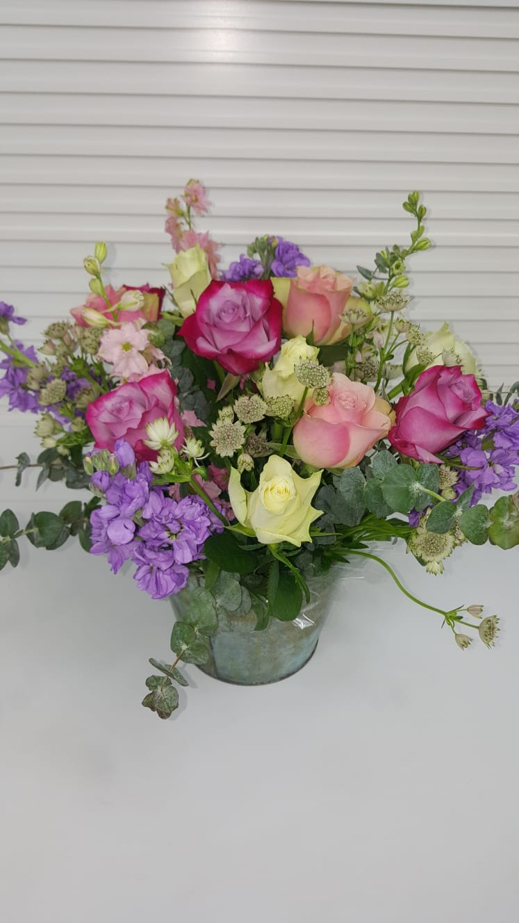 Galvanized pale filled with lavender roses, lax pure, astranita, eucalyptus, African roses