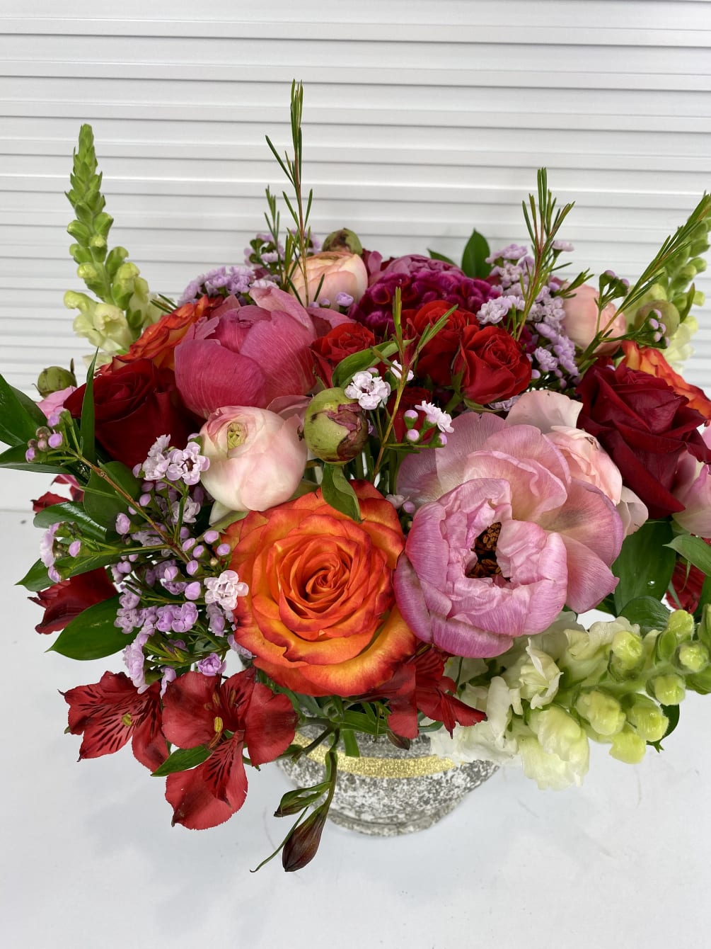 Seasonal Peonies or garden roses, Roses, Lisianthus, fillers and greenery in an