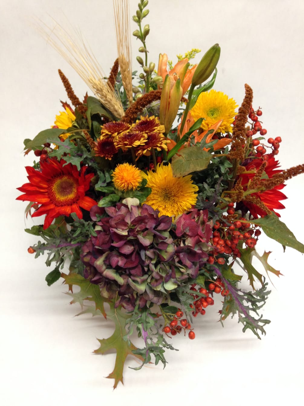 This autumnal inspired arrangement comes complete with mums, sunflowers, asiatic lilies, hydrangeas